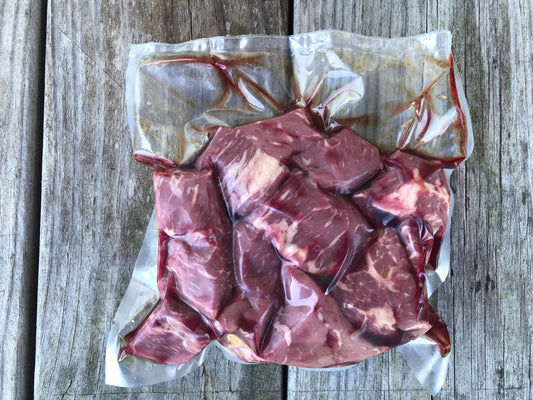The backside of a vacuum-sealed package of beef stew meat pieces from Robie Farm in Piermont NH