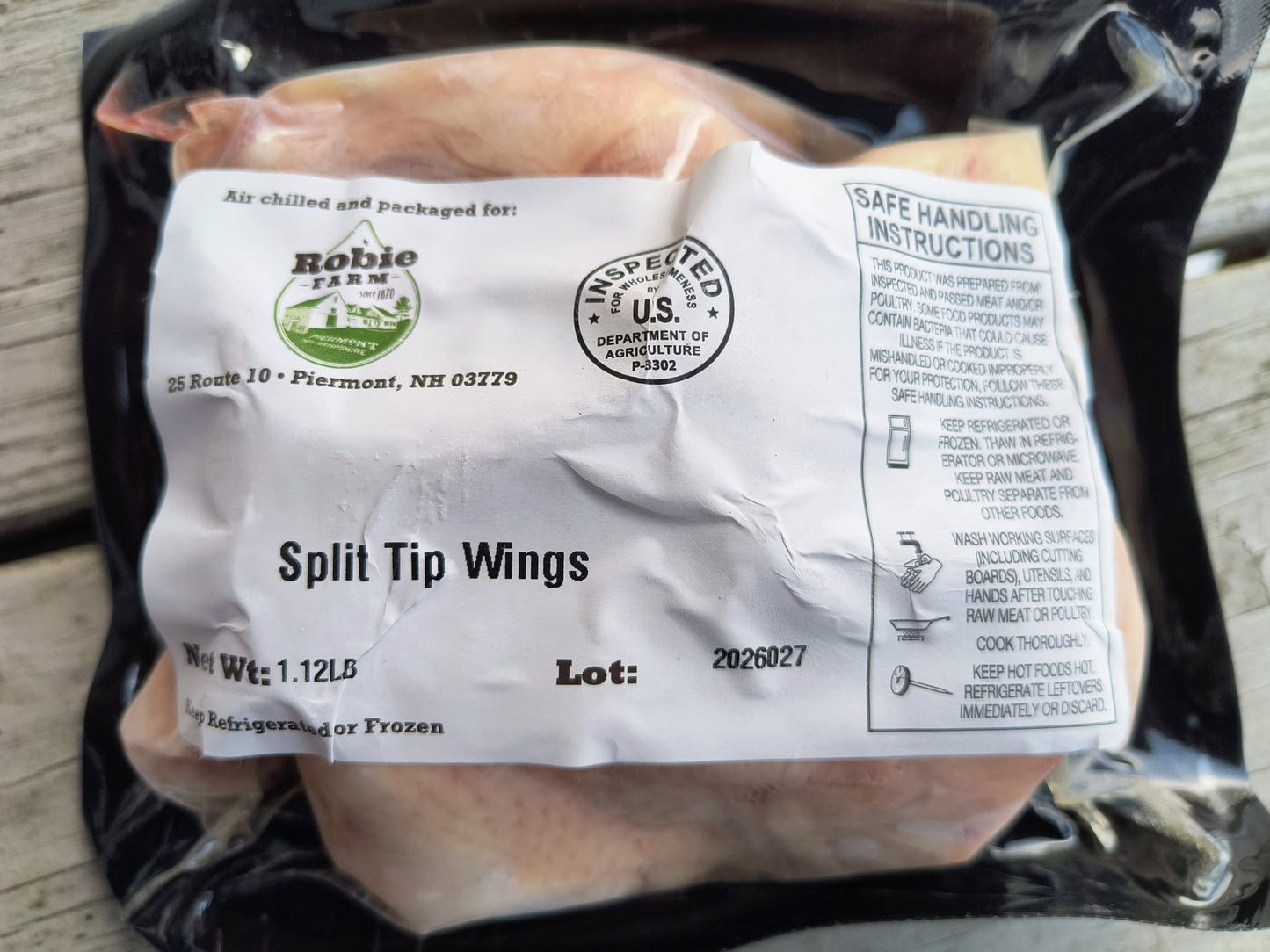 Close up image of a package of frozen split tip chicken party wings from the Robie Farm in NH