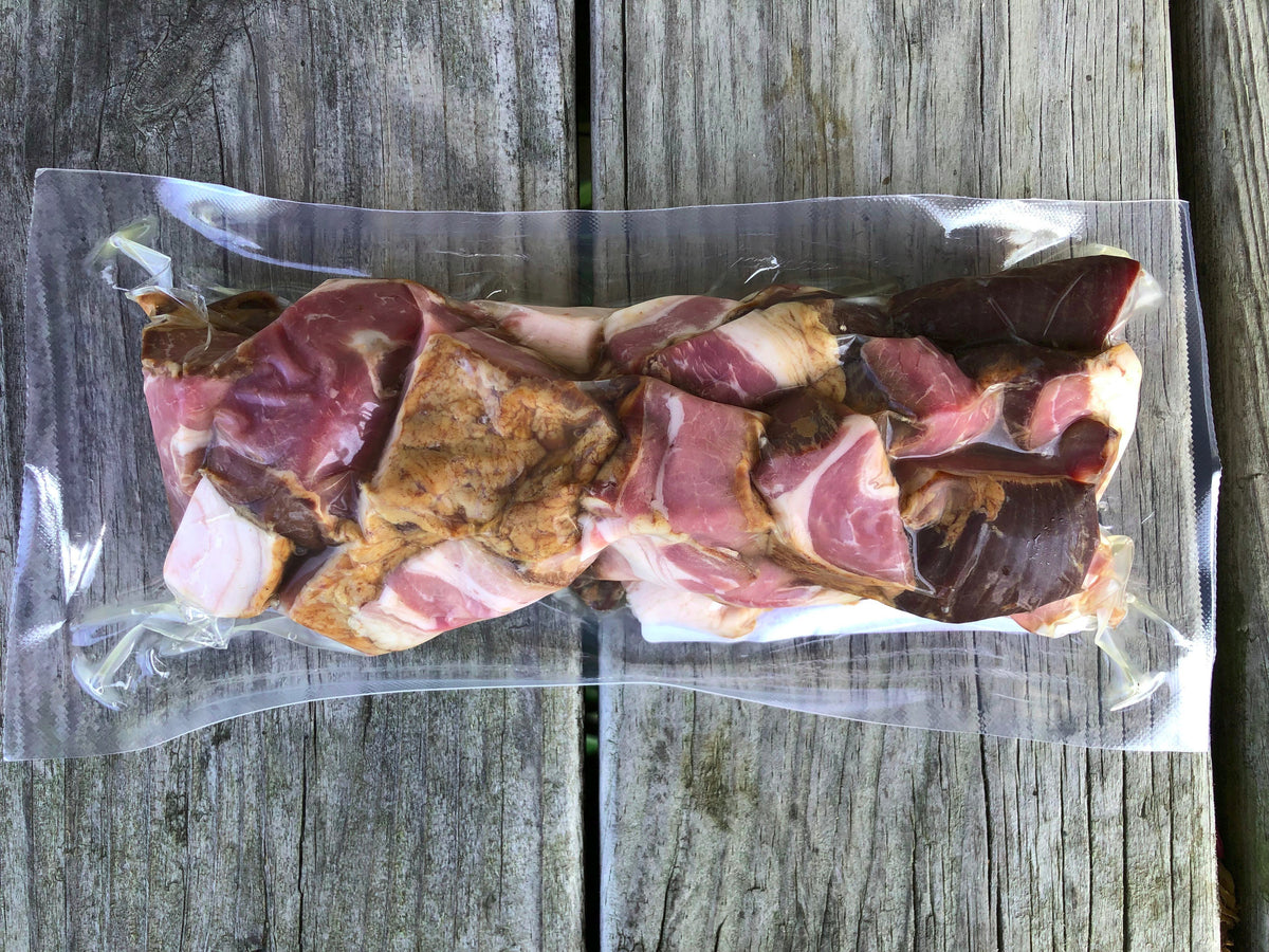 Vacuum-sealed package of Robie Farm uncured pork bacon ends