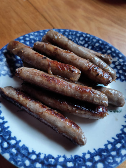 Pan fried maple breakfast sausages on a plate at the Robie Farm
