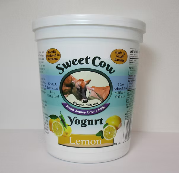 Container of Sweet Cow Lemon Yogurt on a white background