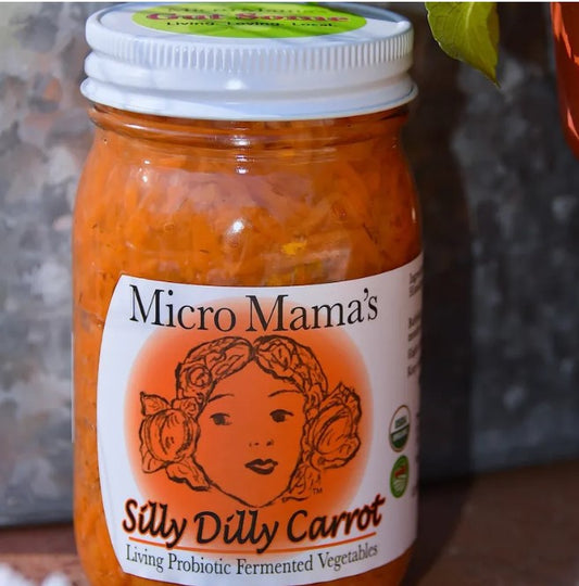 Jar of 'Micro Mama's Silly Dilly Carrot' with a label on a blurred background