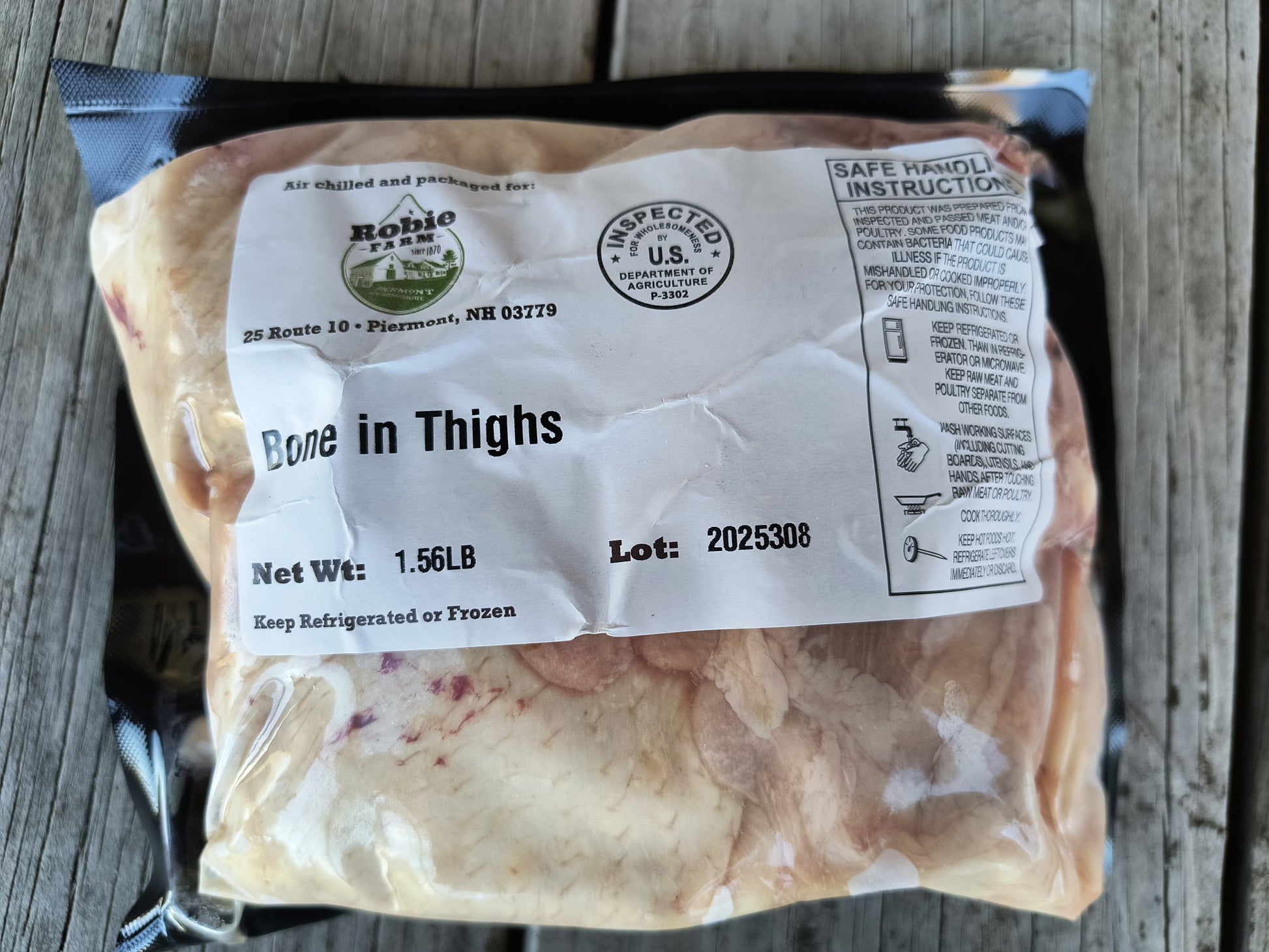 Packaged Robie farm bone in chicken thighs