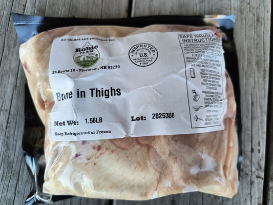 Packaged Robie farm bone in chicken thighs