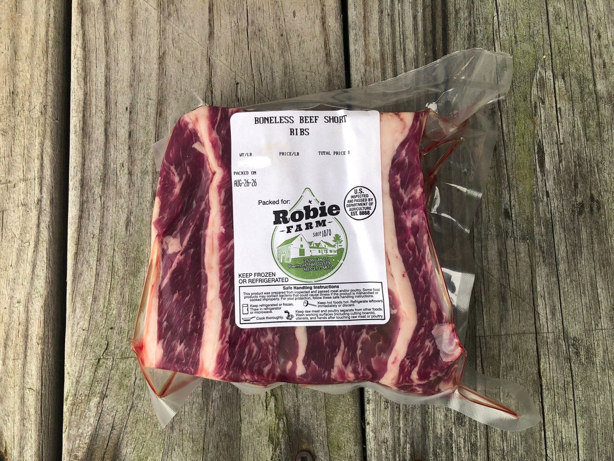 A vaccum-sealed package of Robie Farm boneless beef short ribs