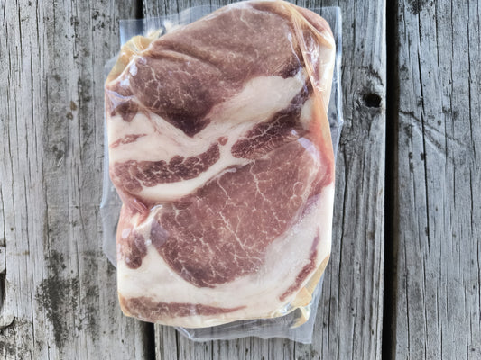 Backside of a package of boneless pork