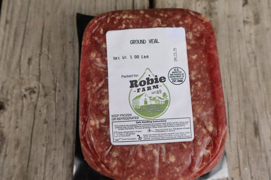 Packaged ground veal from Robie Farm resting on a wooden surface