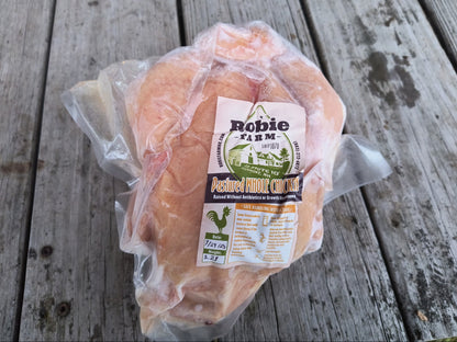 Packaged pastured whole chicken from Robie Farm with a 'Robie Farm' label