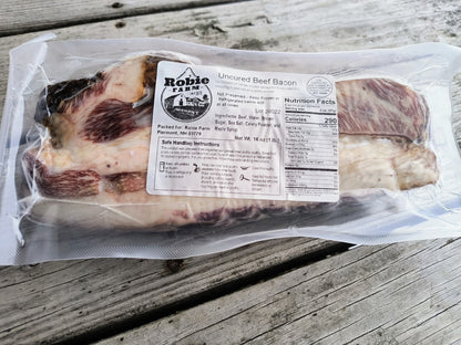 Frozen package of uncured beef bacon from the Robie Farm