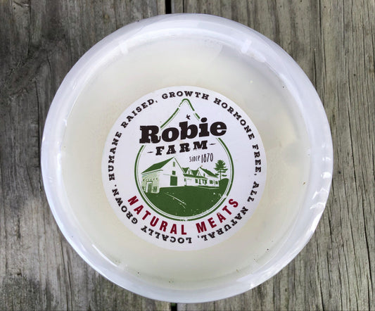 A round plastic tub of Robie Farm rendered pork lard