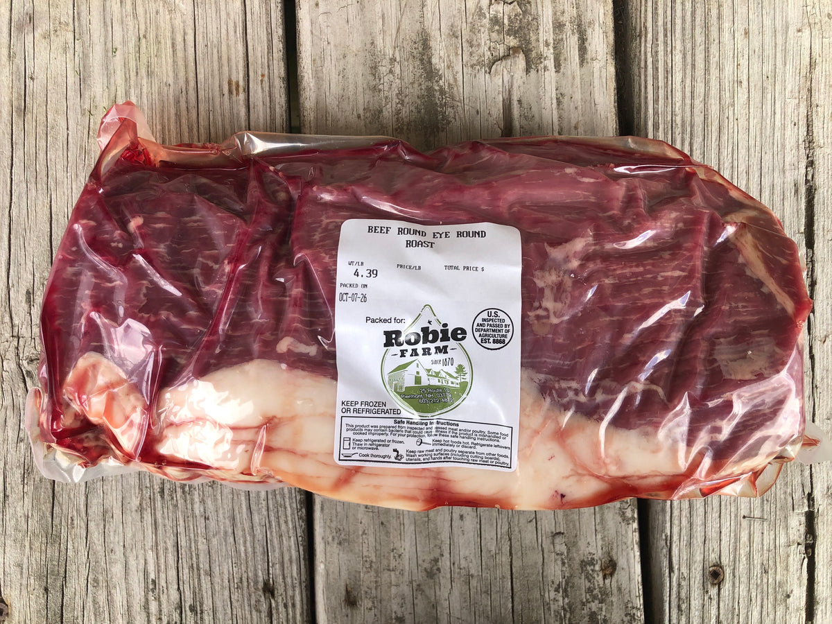 A vacuum sealed frozen package of Robie farm eye round roast 