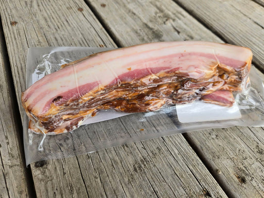 Image of the backside of a package of Robie uncured, smoked, pork bacon