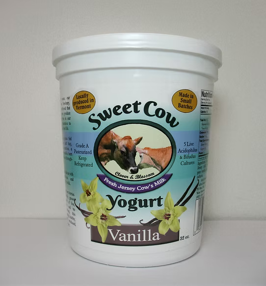 Container of Sweet Cow Vanilla Yogurt on a white background